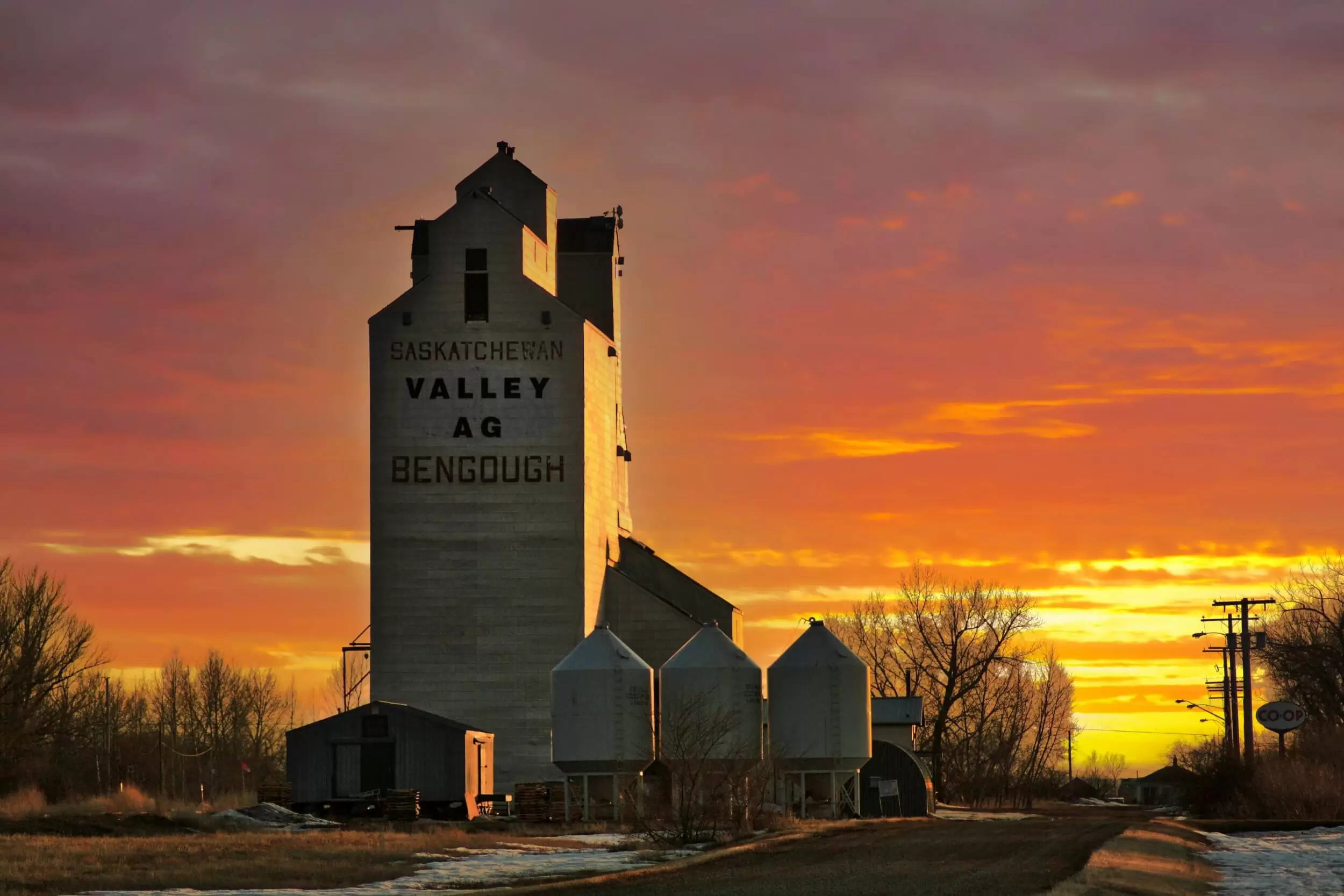 Farm buildings in Bengough, Saskatchewan at sunset